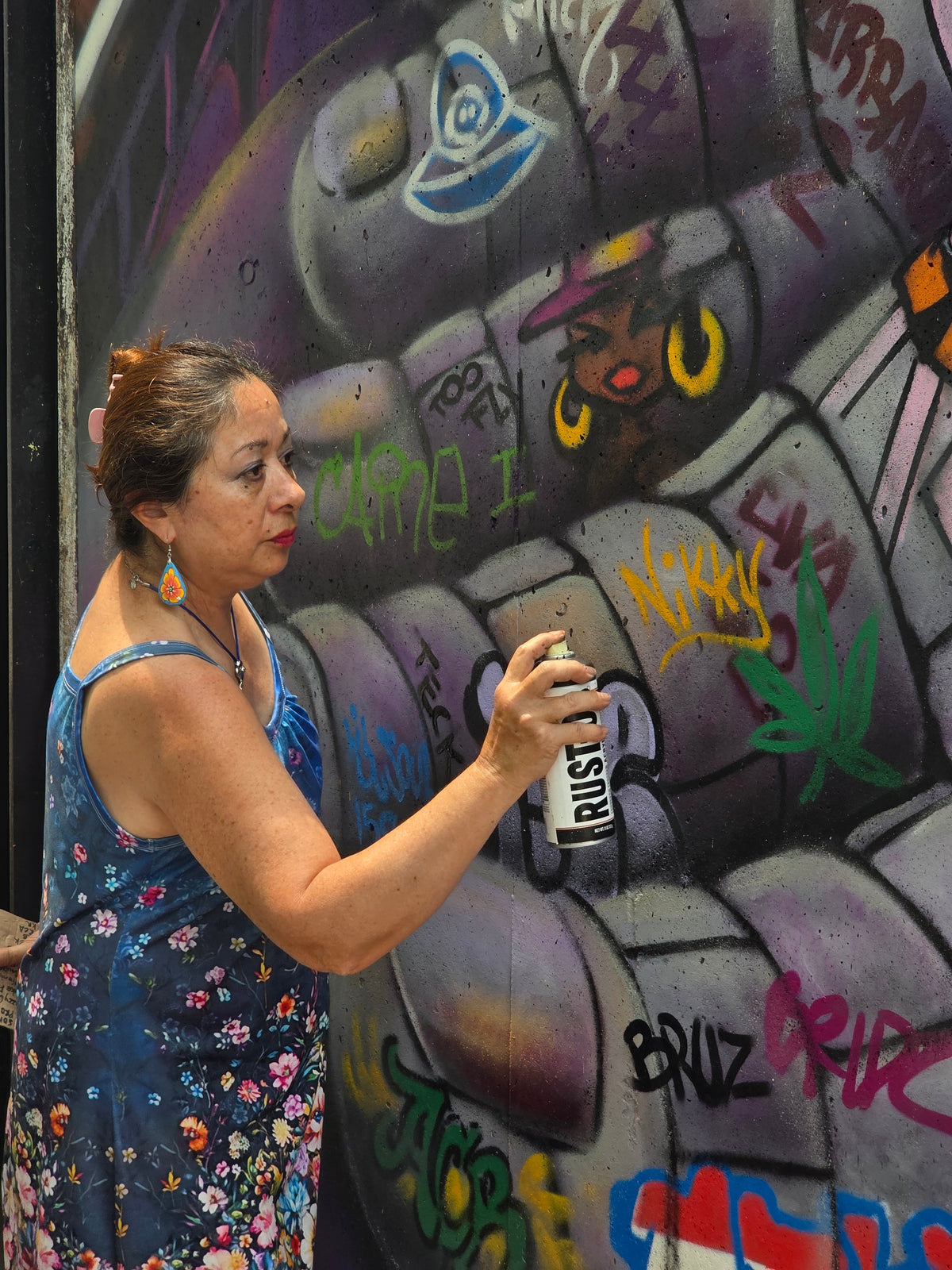 Lady Pink painting a mural at MoMA PS1, June 2025. Photo: Moconnor271.